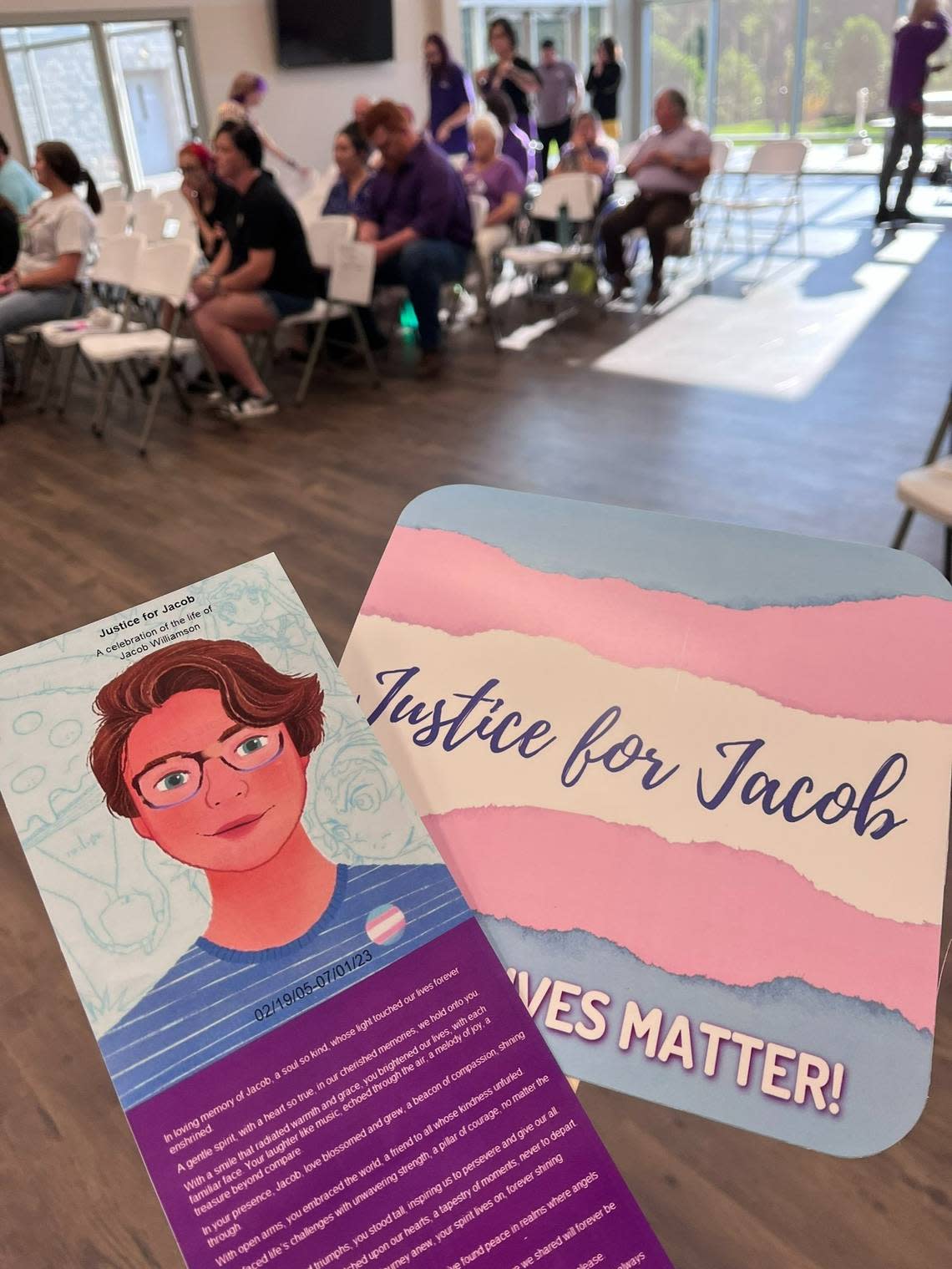 Attendees at Jacob Williamson’s vigil in Laurens, S.C., were handed a program with a portrait drawing of the 18-year-old, and a fan featuring transgender flag colors and the phrase “Justice for Jacob.”