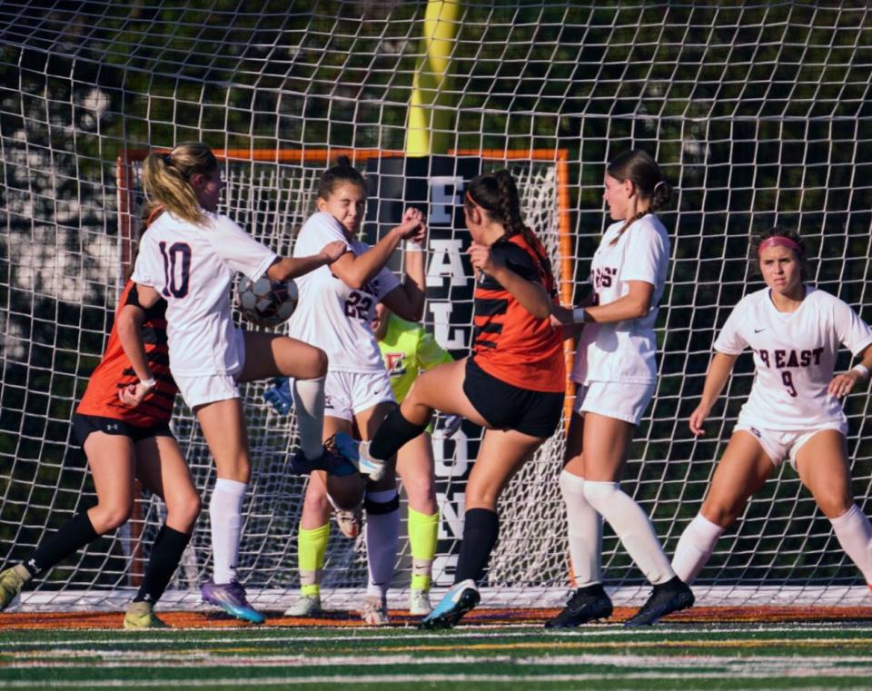 Pennsbury sophomore Izzy DiMattia (center) made history when she scored the Falcons' first-ever goal on their new soccer field on September 27, 2023. CB East won the game 8-1.