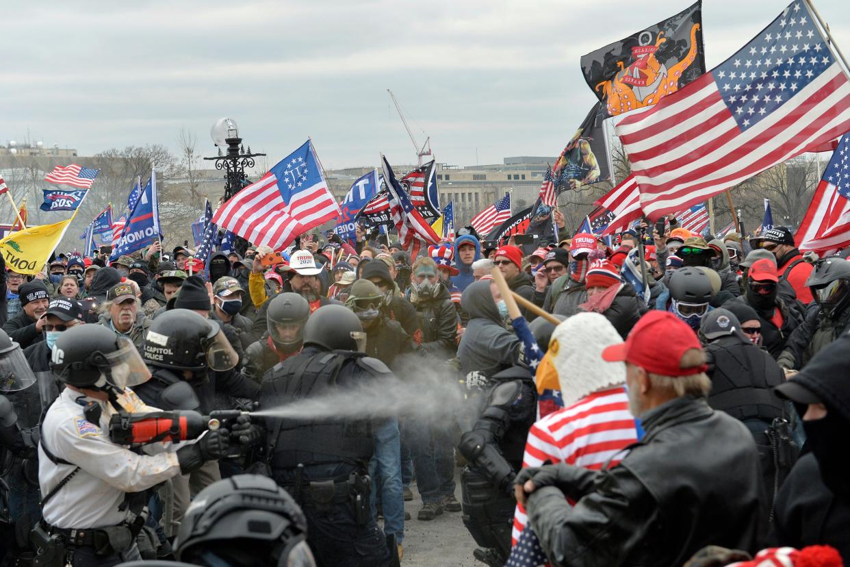 Trump supporters clash with police and security forces as people try to storm the US Capitol Building in Washington, DC, on January 6, 2021.