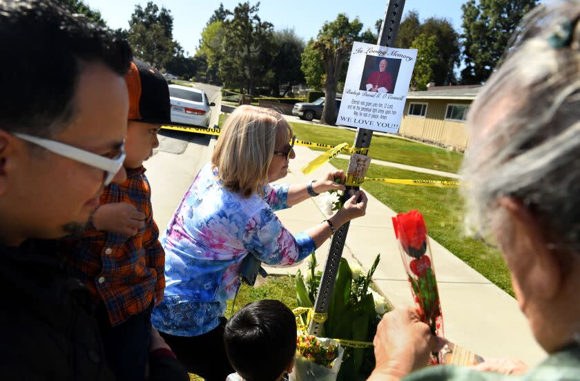 Hacienda Heights, California February 19, 2023- People place flowers near the house where Bishop David O'Connell was murdered in Hacienda Heights. (Wally Skalij/(Los Angeles Times)