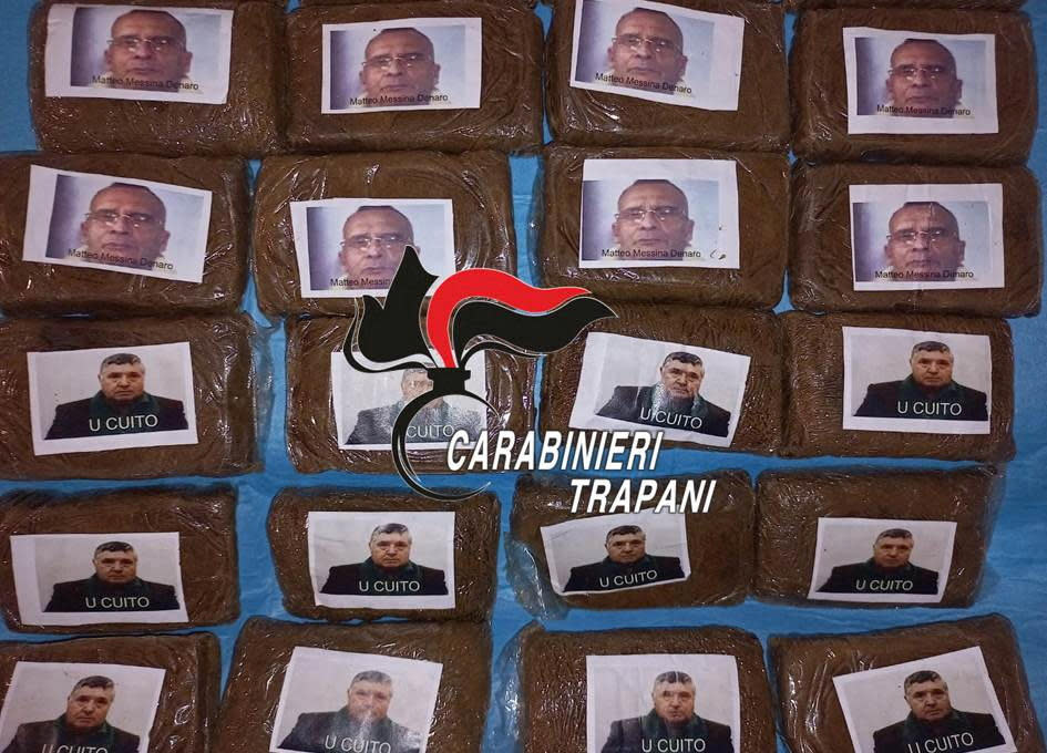 Drug packages decorated with pictures of Sicilian Mafia bosses Salvatore Riina and Matteo Messina Denaro are displayed in Marsala, Italy, March 21, 2023.   / Credit: Carabinieri/Handout via REUTERS