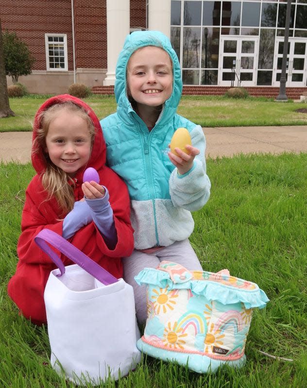 Juliet Brown and Georgia Brown hold up eggs they found during the Bunny Run 5K and 1-mile Fun Run/Bunny Hop hosted by the Dream Center of Jackson on the lawn of Union University in Jackson, Tennessee on Saturday, March 08, 2023. Awards were given to the top three males and female finishers during the event, which is held annually to benefit the operations of the Dream Center. An Easter Egg hunt and a photo opportunity with the Easter Bunny were held for children during the event.