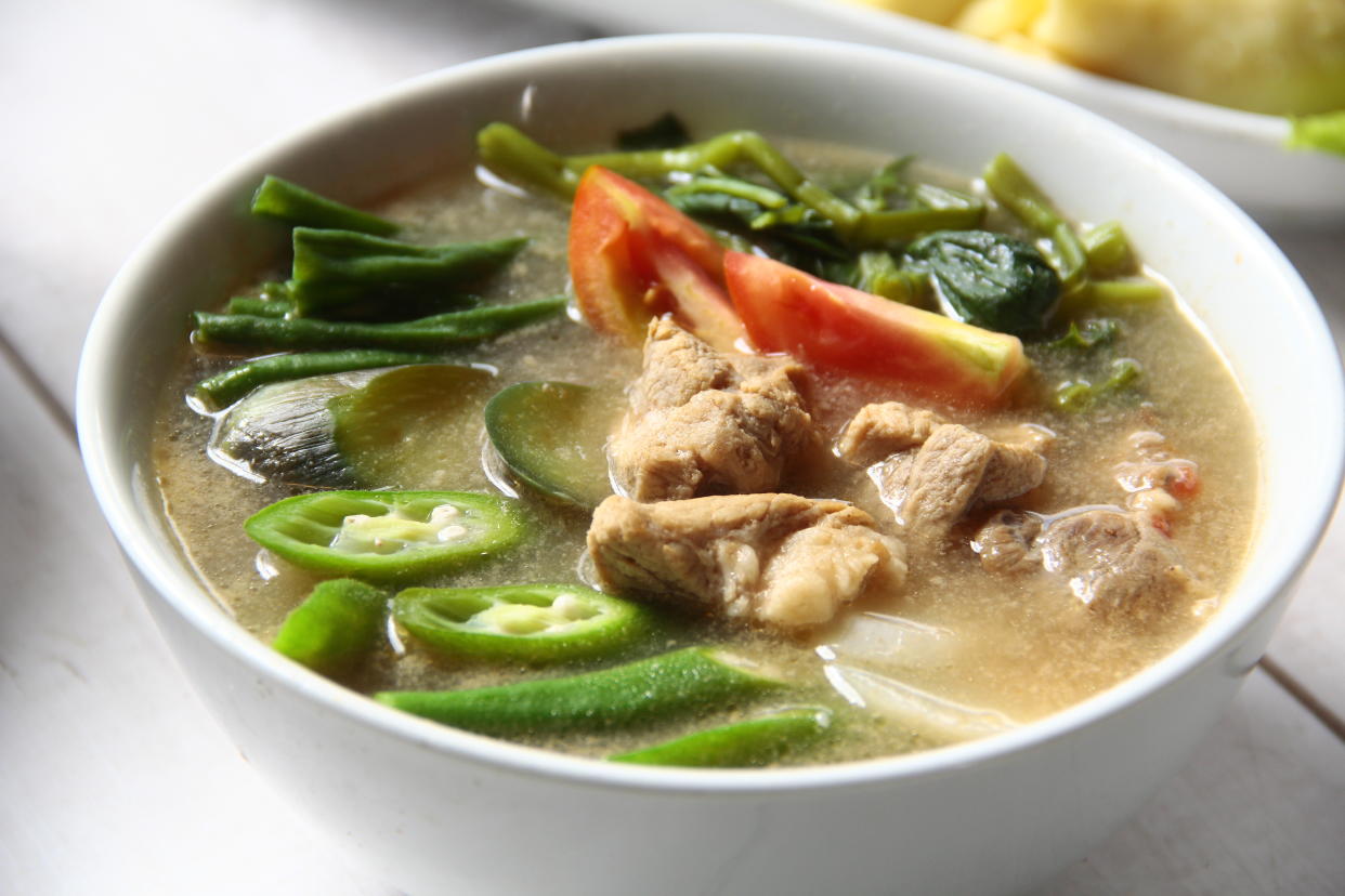 Freshly made Filipino food called Pork Sinigang or pork and vegetables in tamarind broth.