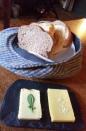 How would you feel if your bread was delivered to your table in a hat? Was the waiter looking for new and clever ways to show off his jaunty hat-wear collection? Perhaps not. One man on Twitter declared "Bring back the plates." #BreadHead