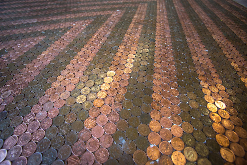 The mosaic of coins comes to life in the evening sun (Francis Hawkins/SWNS.com)