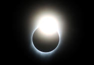 <p>AUG. 21, 2017 – A near total eclipse is seen from South Mike Sedar Park in Casper, Wyoming. Millions of people have flocked to areas of the U.S. that are in the “path of totality” in order to experience a total solar eclipse. During the event, the moon will pass in between the sun and the Earth, appearing to block the sun. (Photo: Justin Sullivan/Getty Images) </p>