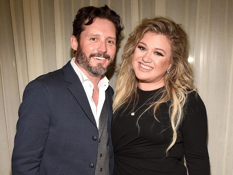 Brandon Blackstock and Kelly Clarkson backstage after she performed songs from her new album "The Meaning of Life" at The Rainbow Room on September 6, 2017 in New York City