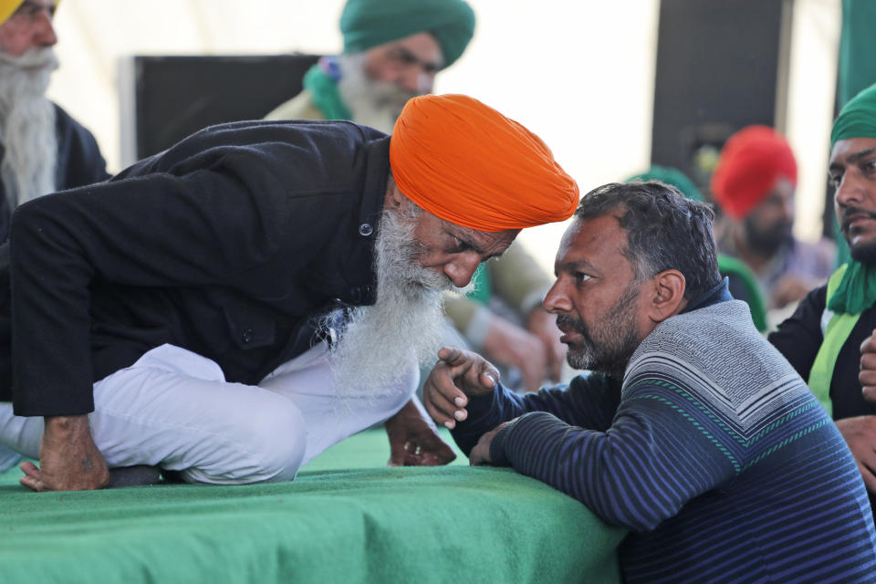 Sikh farmer leaders talk at Singhu, the Delhi-Haryana border camp for protesting farmers against three farm bills, in New Delhi, India, Wednesday, Jan. 27, 2021. Leaders of a protest movement sought Wednesday to distance themselves from a day of violence when thousands of farmers stormed India's historic Red Fort, the most dramatic moment in two months of demonstrations that have grown into a major challenge of Prime Minister Narendra Modi’s government. (AP Photo/Manish Swarup)
