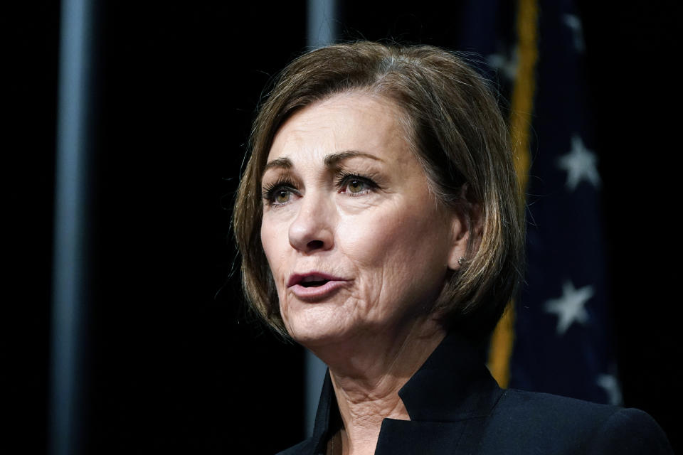 FILE- In this Nov. 19, 2020, file photo Iowa Gov. Kim Reynolds speaks during a news conference in Johnston, Iowa. An organization representing Iowa’s Hispanic population filed a lawsuit Tuesday, March 9, 2021, challenging new restrictions on voting in the state, a day after Reynolds signed the measure into law. The League of United Latin American Citizens, represented by Washington-based voting rights lawyer Marc Elias, filed the lawsuit in state court in Des Moines. (AP Photo/Charlie Neibergall, File)