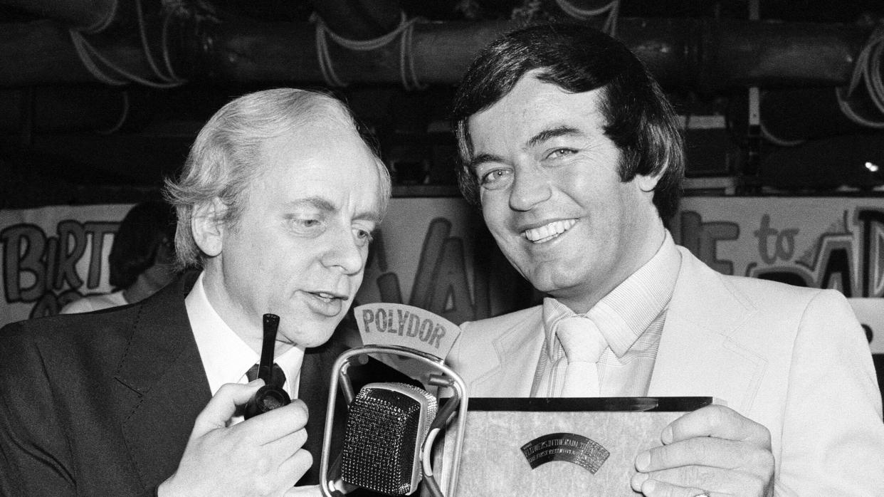 Tony Blackburn (right) was the first DJ's voice to be heard when BBC Radio 1 launched in 1967. (Mirrorpix/Getty)