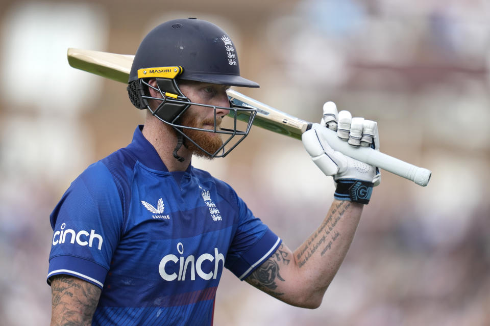 England's Ben Stokes holds up his bat to applause as he is dismissed for 182, breaking the record for the highest ODI score of an England player, during the One Day International cricket match between England and New Zealand at The Oval cricket ground in London, Wednesday, Sept. 13, 2023. (AP Photo/Kirsty Wigglesworth)