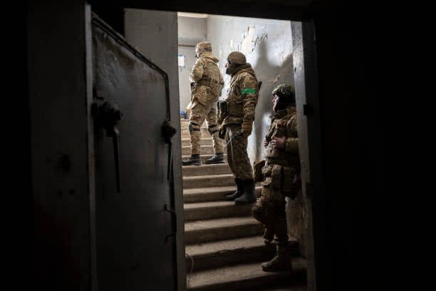 A Ukrainian mortar team waits for shelling to cease before venturing outside a bunker to return fire towards a Russian position on 16 February 2023 in Bakhmut, Ukraine (Getty Images)