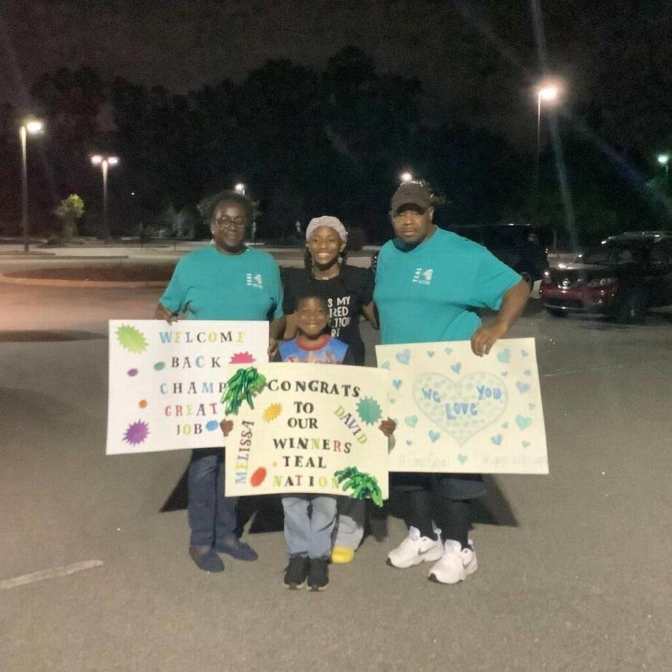 Melissa Jefferson with her mother Johanna, father Melvin, and their grandson following a track meet.