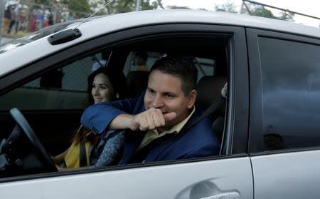 FILE PHOTO: Fabricio Alvarado, presidential candidate of the National Restoration party (PRN), reacts in a car during his visit to a neighbourhood in San Jose, Costa Rica, January 27, 2018. REUTERS/Juan Carlos Ulate