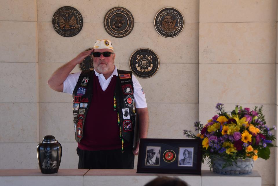 Chip Hanson, Brevard Veterans Memorial Center chaplain, salutes during the Jan. 27 interment ceremony for WWII Marine Corps veteran Frank Roth at Cape Canaveral National Cemetery.