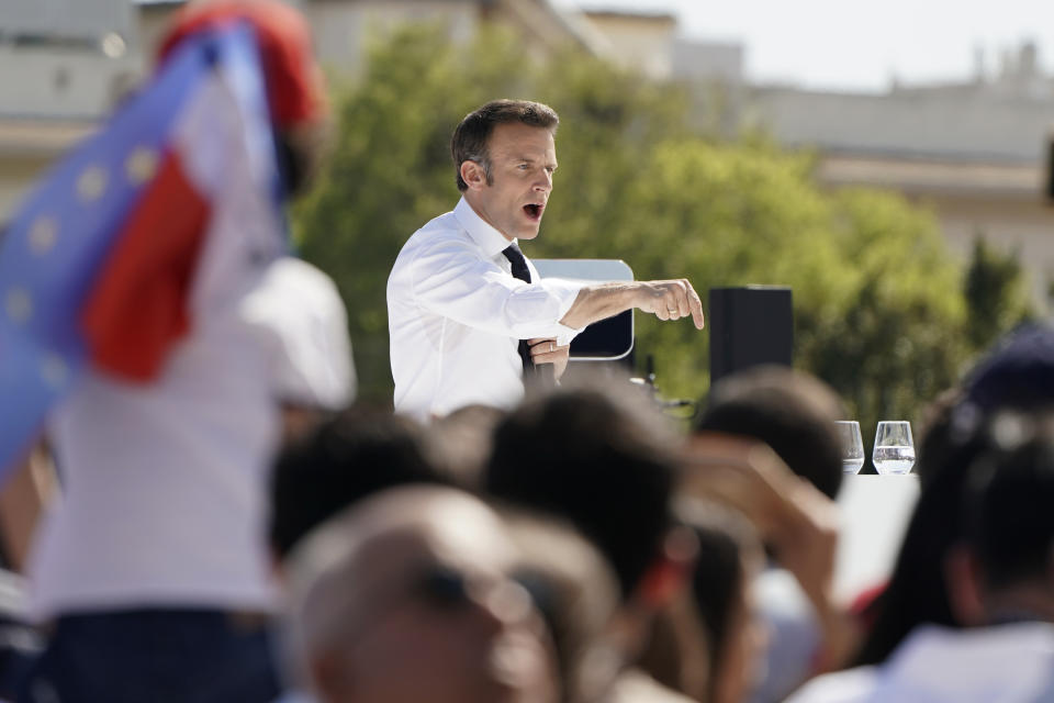 French President and centrist candidate Emmanuel Macron speaks during a campaign rally, Saturday, April 16, 2022 in Marseille, southern France. Far-right leader Marine Le Pen is trying to unseat centrist President Emmanuel Macron, who has a slim lead in polls ahead of France's April 24 presidential runoff election. (AP Photo/Laurent Cipriani)