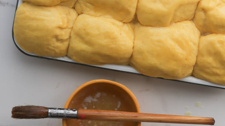 Tray of unbaked rolls