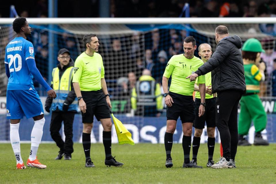Ian Evatt speaks to the match officials at the end of Saturday's 3-3 draw at Peterborough United <i>(Image: Camerasport)</i>