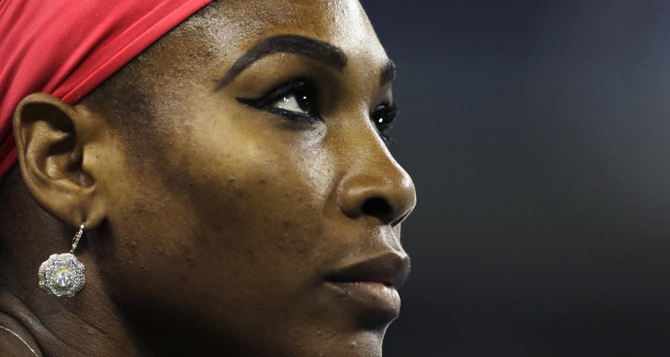 Serena Williams, of the United States, looks up at the scoreboard during her match against Francesca Schiavone, of Italy, in the first round of the 2013 U.S. Open tennis tournament, Monday, Aug. 26, 2013, in New York. (AP Photo/Charles Krupa)