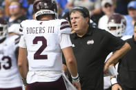 Mississippi State coach Mike Leach, right, talks to Mississippi State quarterback Will Rogers during the first half of an NCAA college football game against Memphis, Saturday, Sept. 18, 2021, in Memphis, Tenn. (AP Photo/John Amis)