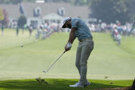 Dustin Johnson hits on the first fairway during a practice round for the Masters golf tournament on Wednesday, April 7, 2021, in Augusta, Ga. (AP Photo/Charlie Riedel)