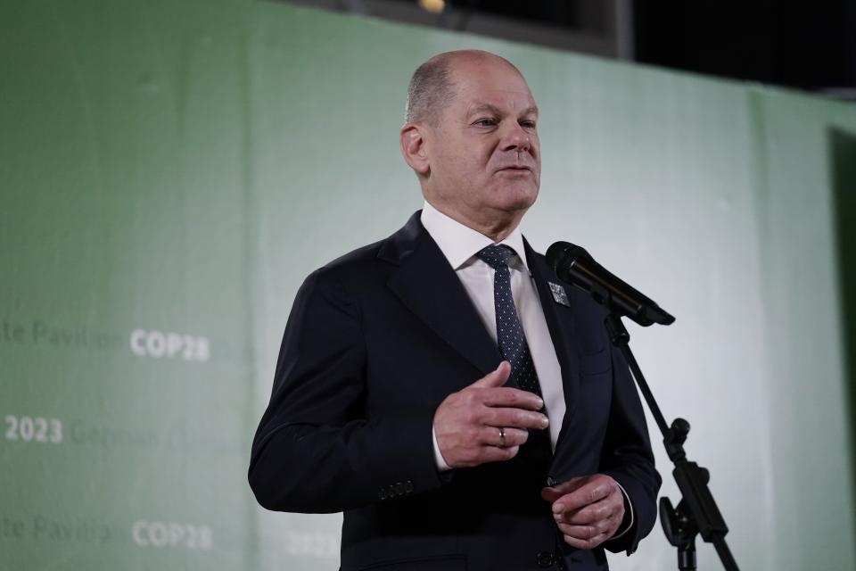 Germany Chancellor Olaf Scholz speaks to members of the media at the COP28 U.N. Climate Summit, Friday, Dec. 1, 2023, in Dubai, United Arab Emirates. (AP Photo/Joshua A. Bickel)