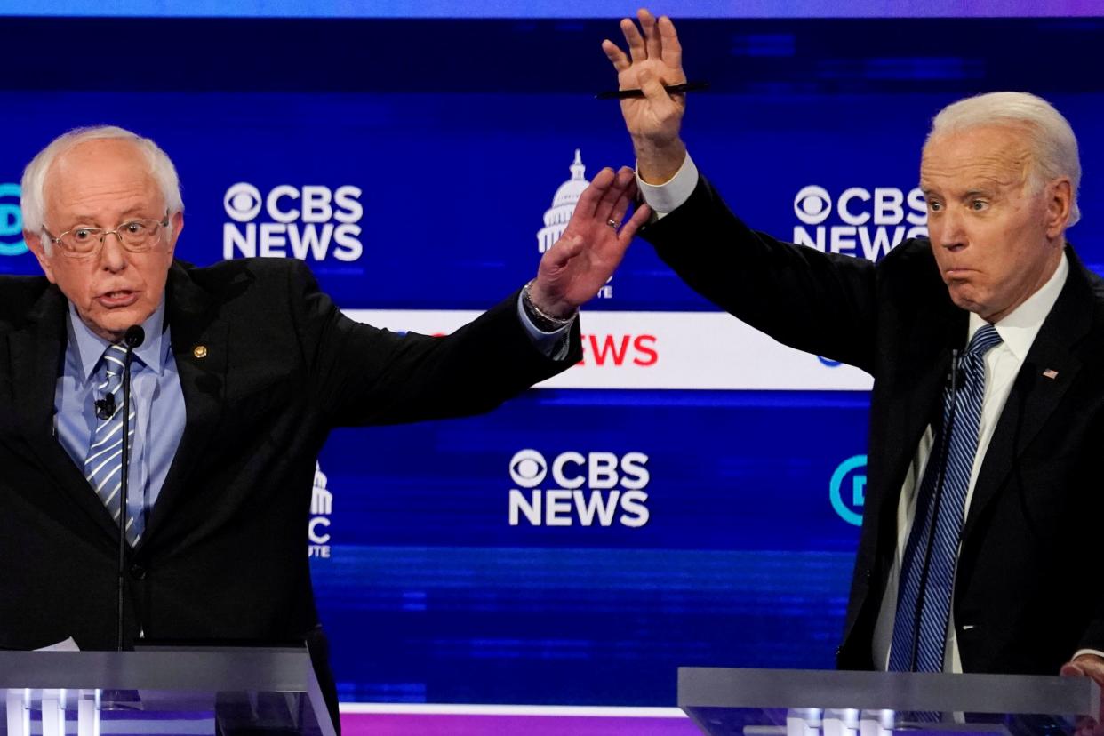 Bernie Sanders and Joe Biden taking part in the Democratic debate in Charleston, South Carolina: REUTERS