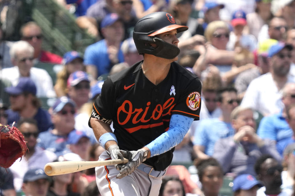 Baltimore Orioles' Adam Frazier hits a one-run single during the sixth inning of a baseball game against the Chicago Cubs in Chicago, Sunday, June 18, 2023. (AP Photo/Nam Y. Huh)