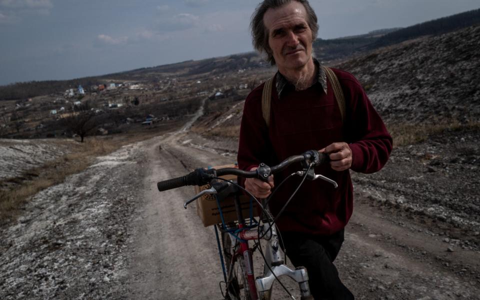 BOHORODYCHNE, UKRAINE - MARCH 24: 56 year-old Yuri Ponurenko walks home after receiving humanitarian aid as daily life continues under difficult conditions amid Russia-Ukraine war in the village of Bohorodychne of Donetsk Oblast, Ukraine on March 24, 2023. The village of Bohorodychne in the Donetsk Oblast of eastern Ukraine was one of the frontlines of the war in June and was under control of Russian forces in August until it was liberated by Ukrainian forces in September 2022. (Photo by Wolfgang Schwan/Anadolu Agency via Getty Images) - Wolfgang Schwan/Anadolu Agency via Getty Images