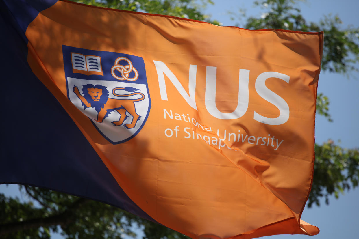 Logo and crest of NUS seen on a flag. (Yahoo News Singapore file photo)