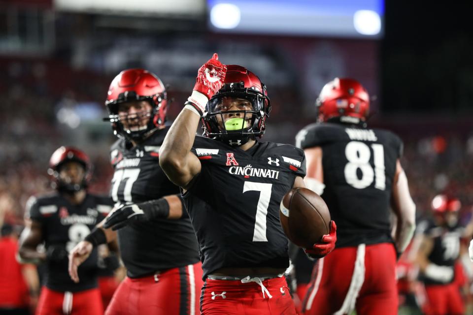 Cincinnati's Tre Tucker, a CVCA graduate, celebrates a touchdown during the Bearcats' win over South Florida earlier this season. Cincinnati will take on No. 1 Alabama in a semifinal of the College Football Playoffs on Friday.