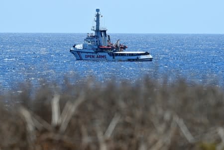 Spanish migrant rescue ship Open Arms is seen close to the Italian shore in Lampedusa