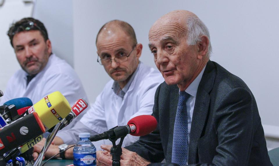 Payen, head anaesthetician at the CHU hospital, neurosurgeon Chabardes and Professor Saillant attend a news conference at the CHU Nord hospital emergency unit in Grenoble