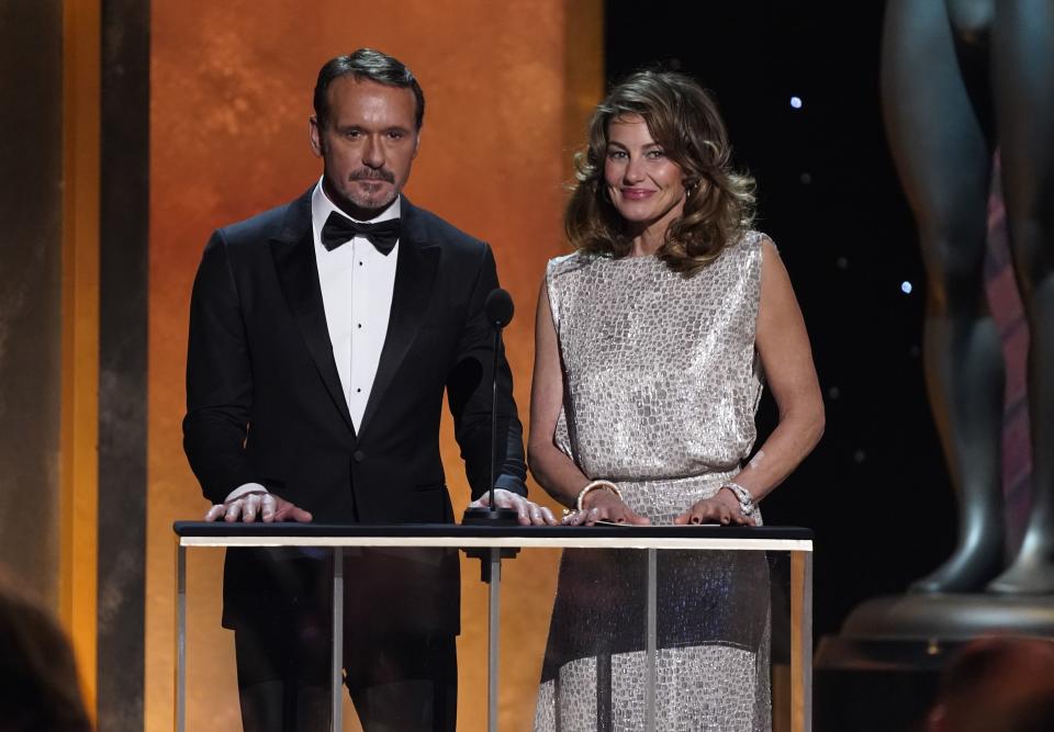 Tim McGraw, left, and Faith Hill present the award for outstanding performance by a male actor in a drama series at the 28th annual Screen Actors Guild Awards at the Barker Hangar on Sunday, Feb. 27, 2022, in Santa Monica, Calif. 