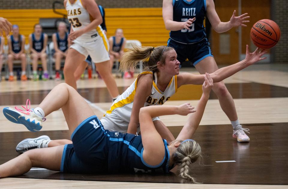 Central’s Maddy Shirley (32) tries to save the loose ball as the Central Lady Bears play the Reitz Lady Panthers at Central High School Wednesday, Dec. 13, 2023.