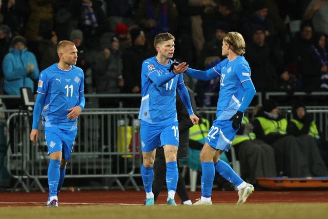 Iceland’s Logi Tomasson, centre, celebrates