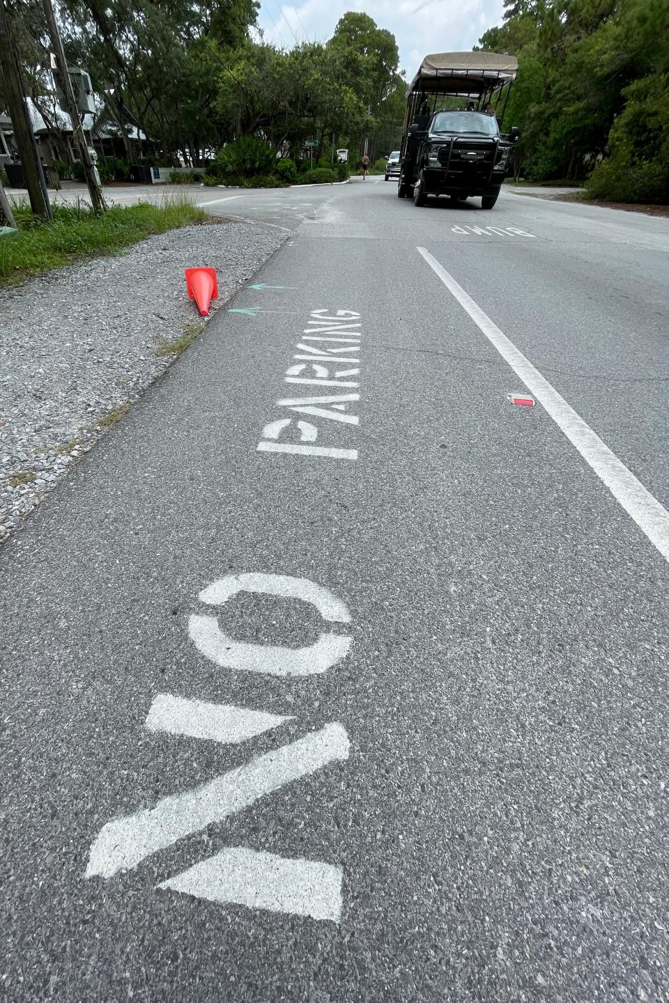 Parking is always at a premium at Grayton Beach. Here, signs warn motorists not to park on the pedestrian and bicycle path leading into town.