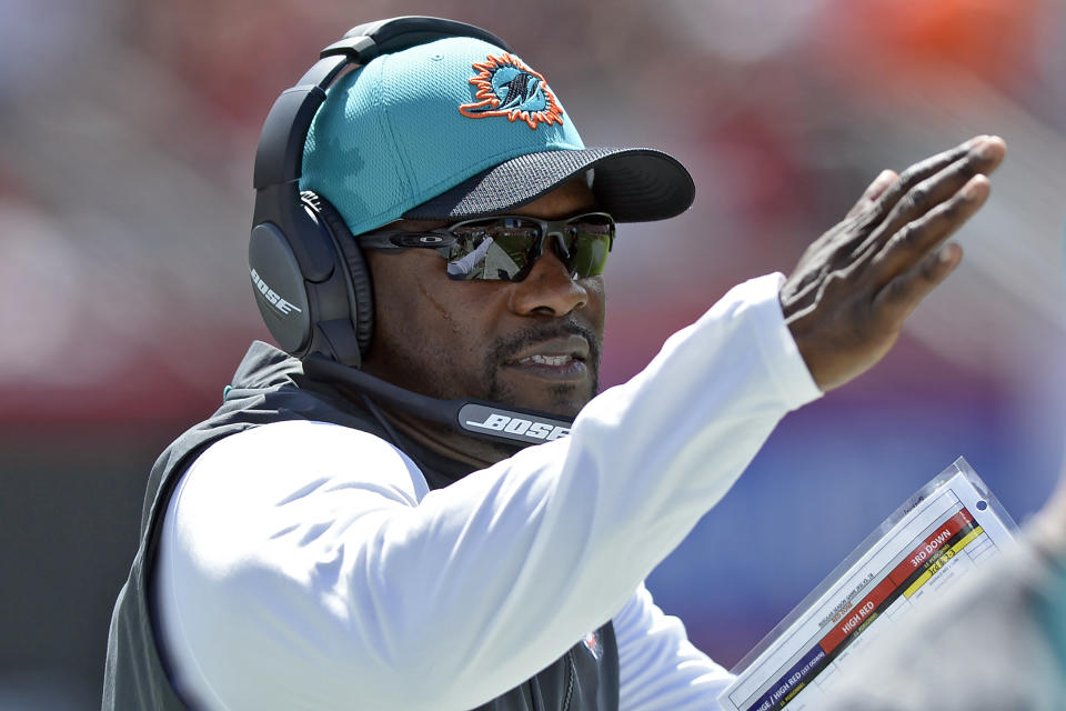 Miami Dolphins head coach Brian Flores calls a play against the Tampa Bay Buccaneers during the first half of an NFL football game Sunday, Oct. 10, 2021, in Tampa, Fla. (AP Photo/Jason Behnken)