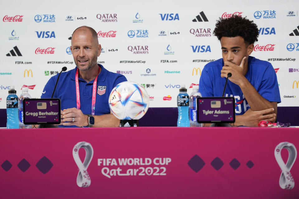 Head coach Gregg Berhalter, left, and Tyler Adams, both of the United States attend a press conference on the eve of the round of 16 World Cup soccer match between the Netherlands and the United States at Kalifa International Stadium, in Doha, Qatar, Friday, Dec. 2, 2022. (AP Photo/Ashley Landis)