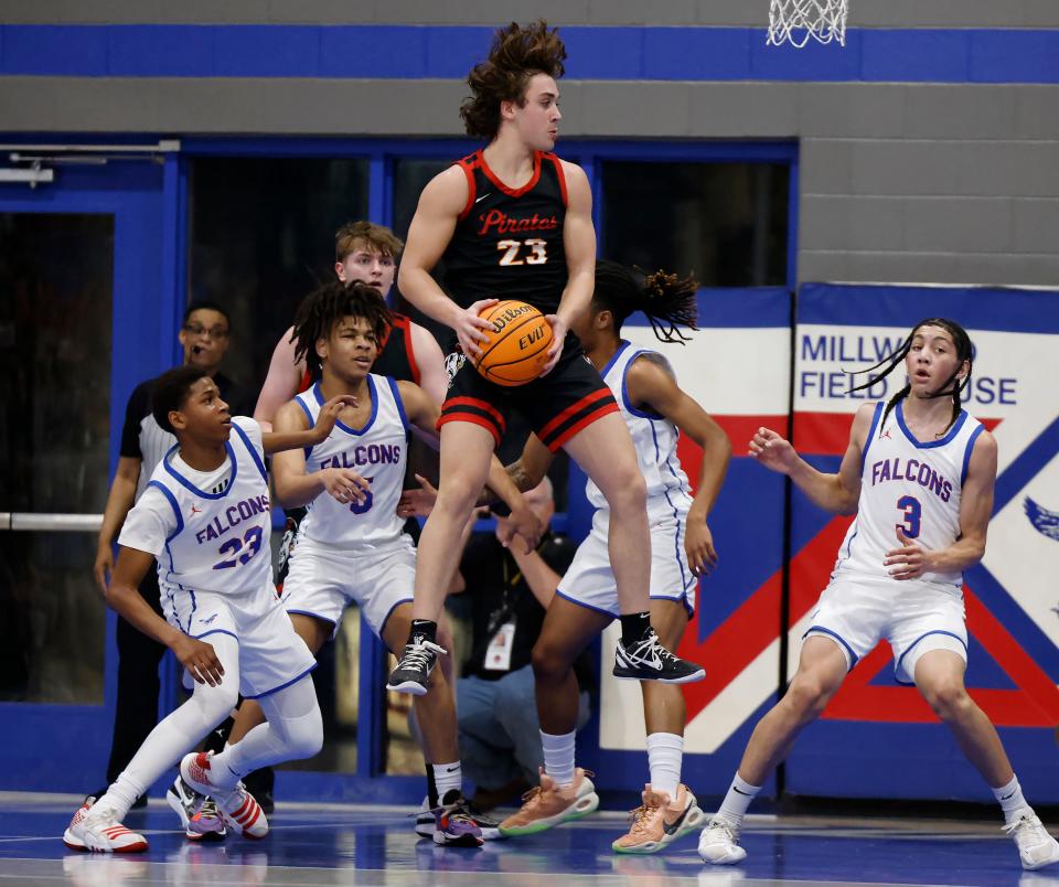 Dale's Deken Jones (23) catches a rebound during a high school basketball game against Millwood, Tuesday, Jan. 23, 2024, at Millwood High School in Oklahoma City.