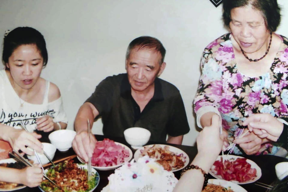 In this photo taken and released by Xi Chunmei, Xi Jingbo eats a meal with his family in Linkou county, Mudanjiang city in northeastern China's Heilongjiang province May 15, 2018. More than 2,500 children of about 400,000 Japanese - many of them families of Imperial Army soldiers, Manchurian railway employees and farmers who had emigrated to northern China, where Japan established a wartime puppet state - were displaced or orphaned. Xi Jingbo's parents were Japanese, but he had no official record of his place and date of birth. Villagers told him he was left behind when the Japanese fled after the surrender. (Xi Chunmei via AP)