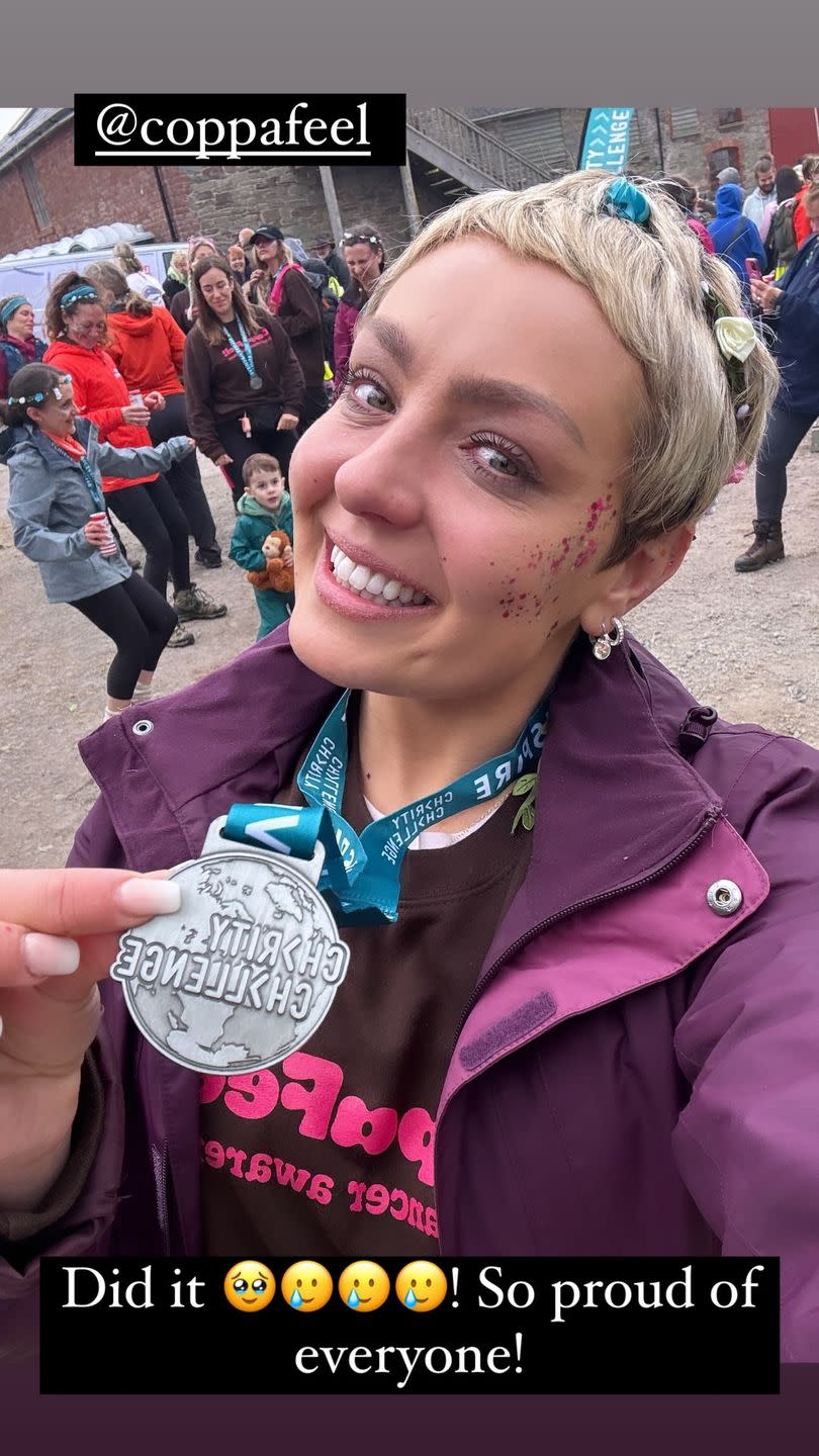 amy dowden holds a medal in a social media selfie