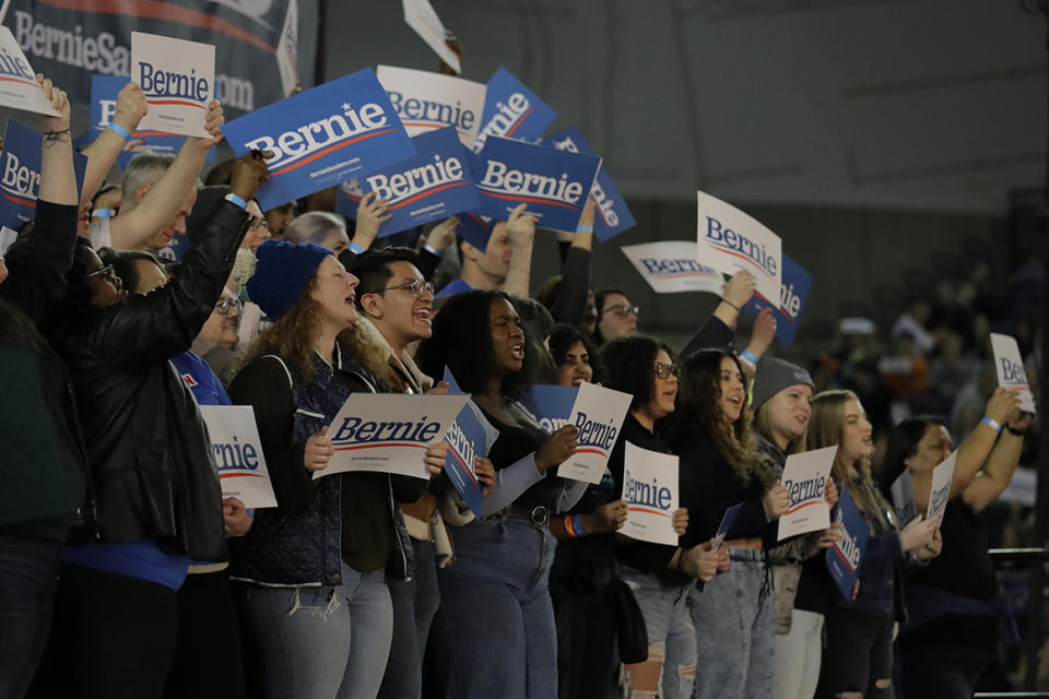 Supporters wave signs during a campaign event for Democratic presidential candidate Sen. Bernie Sanders, I-Vt., in Tacoma, Wash., Monday, Feb. 17, 2020. (AP Photo/Ted S. Warren)