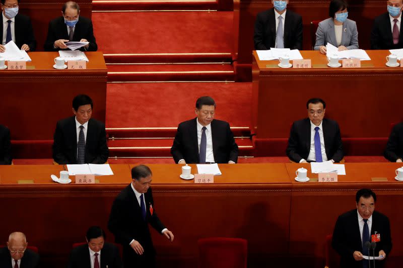 Chinese President Xi Jinping and officials attend for the opening session of CPPCC in Beijing