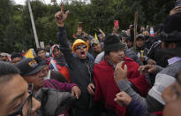 FILE - Demonstrators protest against the government of President Guillermo Lasso in Tambillo, Ecuador, on June 20, 2022. As food costs and fuel bills soar, inflation is plundering people’s wallets, sparking a wave of protests and workers’ strikes around the world. (AP Photo/Dolores Ochoa)