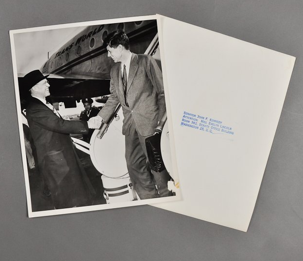 JFK exits a plane and shakes hands with his father, Joe Kennedy, after winning a seat in the Senate in 1952. <a href="http://www.mcinnisauctions.com/" rel="nofollow noopener" target="_blank" data-ylk="slk:(Photo courtesy of John McInnis Auctioneers);elm:context_link;itc:0;sec:content-canvas" class="link ">(Photo courtesy of John McInnis Auctioneers)</a>