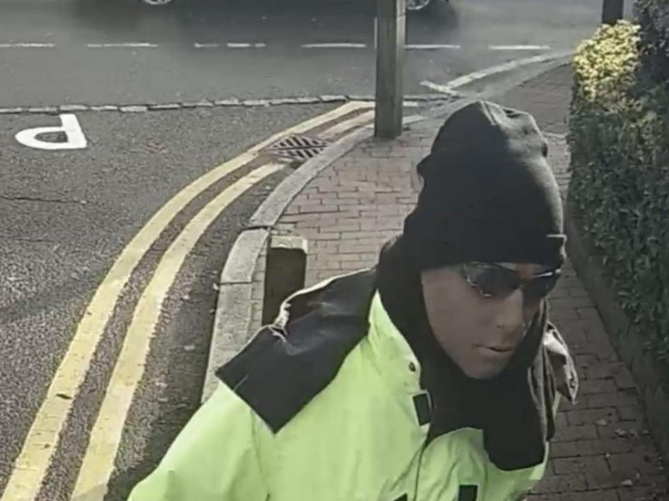 The clip shows a man wearing high-vis work clothes (PA)