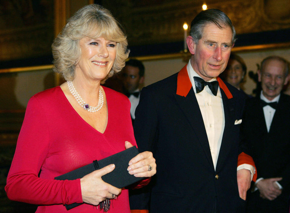 FILE - Britain's Prince Charles and his fiancee Camilla Parker Bowles arrive for a party at Windsor Castle, England, Thursday Feb. 10, 2005, following the announcement of their engagement. After seven decades, the United Kingdom has a new woman to call queen. Camilla, Duchess of Cornwall, will be known as Queen Consort, a title that came with Queen Elizabeth II’s blessing after many years of contention, dating back to the years before she even married Prince Charles.(Jim Watson, Pool Photo via AP, file)