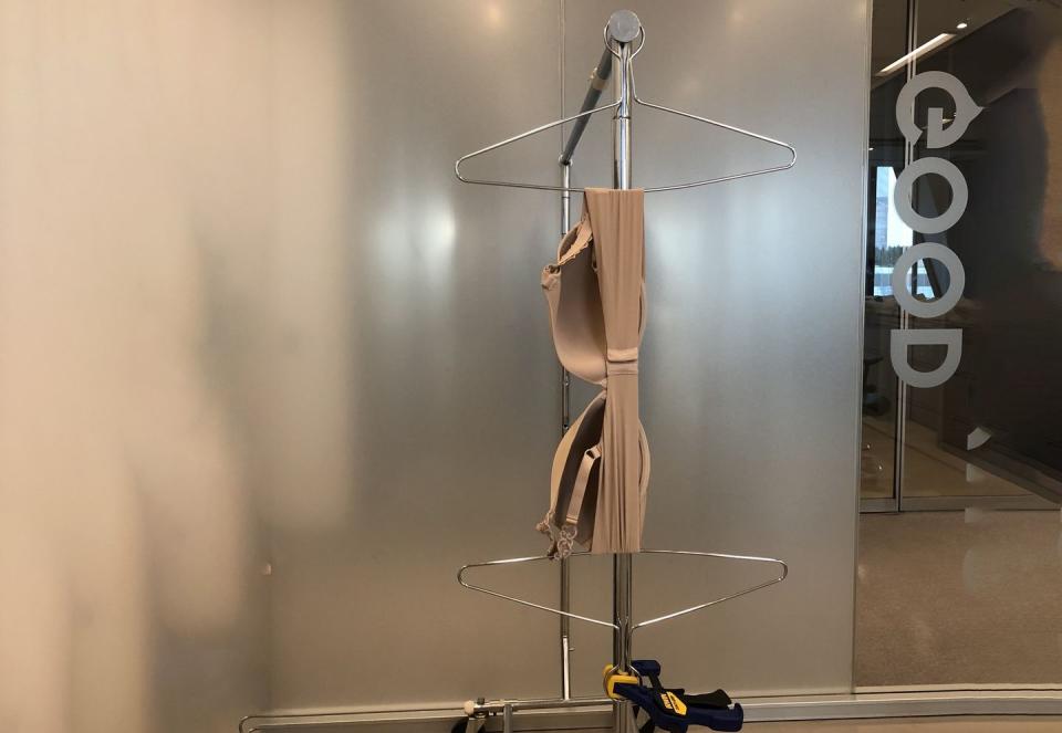 a bra being tested for stretch recovery at the good housekeeping institute in the textiles lab