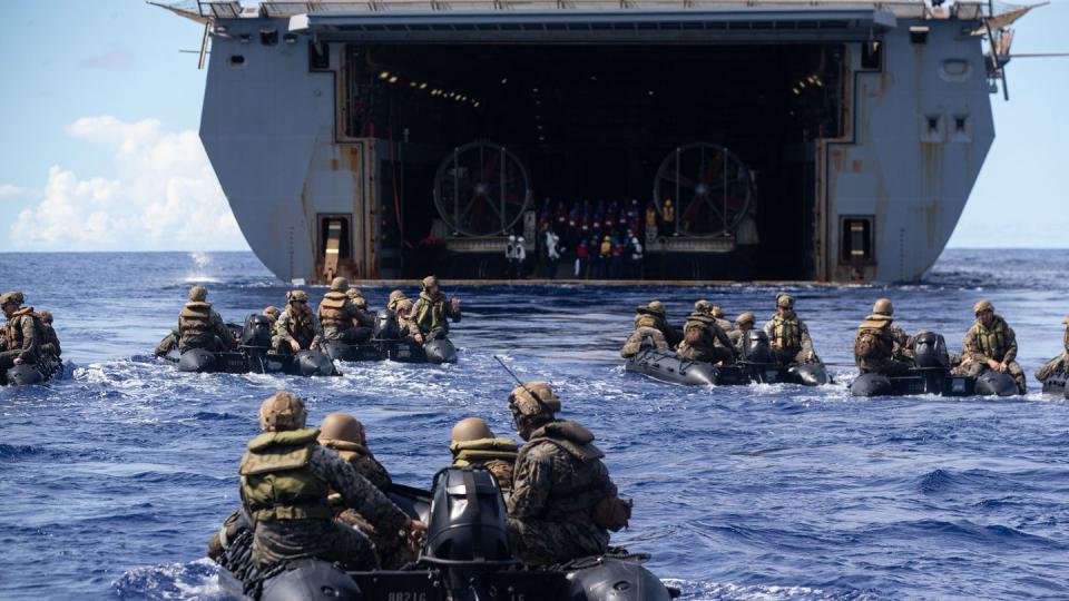 U.S. Marines sit in formation in combat rubber raiding crafts during a launch and recovery exercise with the amphibious transport dock New Orleans in the Philippine Sea on Aug. 6, 2022. (Lance Cpl. Yvonne Iwae/U.S. Marine Corps)